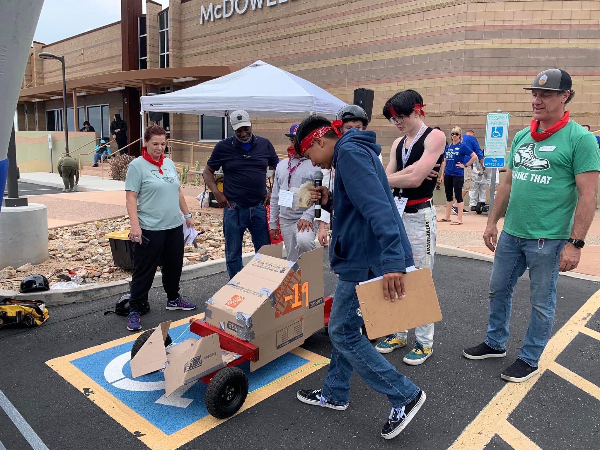 Group of teens building a go kart